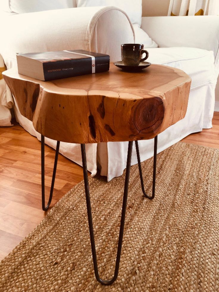Live-edge mvule coffee table with black steel hairpin legs